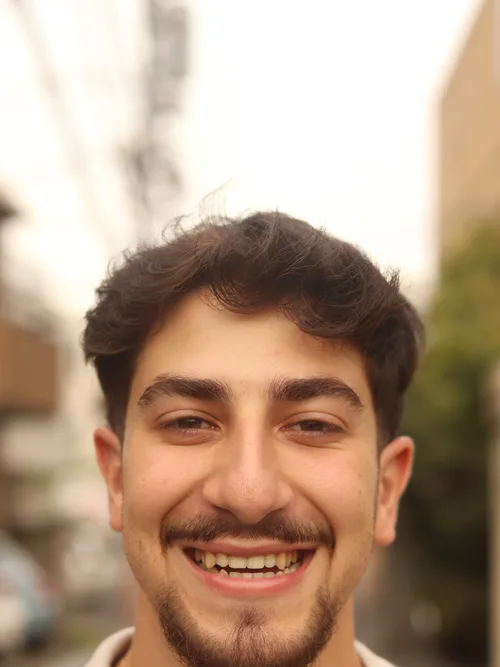 Portrait of a smiling model on a city street